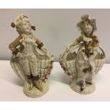 A pair of 19th century Possneck figures 23cm tall.