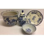 4 pieces of blue & white ceramics: a planter, a Delft lidded vase and a bowl with dragon base and