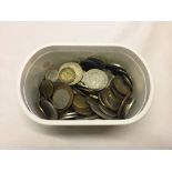 A small tub containing world coins.