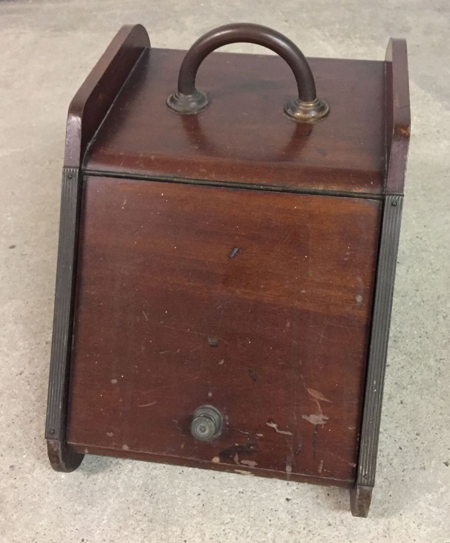 A wooden coal box without a metal liner and scoop.