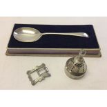 3 silver items comprising: boxed caddy spoon hallmarked Sheffield 1923, small engraved buckle