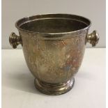 A silver plated wine cooler / ice bucket.