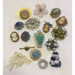 A collection of costume jewellery brooches to include Exquisite.