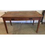 A vintage wooden 2 drawer desk. Approx 137cm x 76cm.