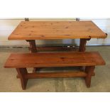 A modern pine kitchen table together with 2 pine benches. Table approx 121 x 72cm.