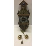 A Dutch wall clock c1970s with brass weights and pendulum.