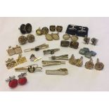 A quantity of cufflinks and tie pins to include Strattons.