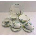 A Melba part tea set, comprising: sandwich plate, 6 side plates, 5 cups, 6 saucers and a sugar bowl