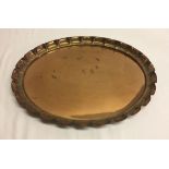 An oval pie crust edge copper tray. Approx 41 x 51cm.