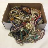 A box containing a large quantity of vintage and modern costume jewellery.