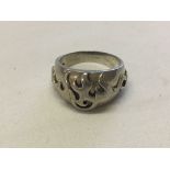 Gents large heavy silver ring with abstract design in relief. Size Z, weight approx 10.6g.