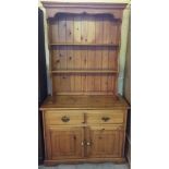 A modern pine dresser. Two drawer and two door cupboard base. 99cm x 185cm approx.