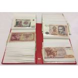 Photo album contaning various world banknotes.