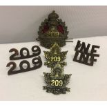 A collection of WW1 Canadian 209 Overseas Battalion 'Swift Current' uniform badges. Comprising cap