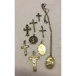 A collection of 6 silver crosses of various designs and 3 St. Christophers medals, together with one