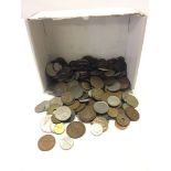 White box containing various world coins.