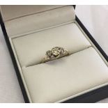 A 9ct gold ladies trilogy, past, present & future ring set with 10pts of diamond. Size M. Total