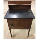 A light oak washstand with marble top approx 62 x 95cm.