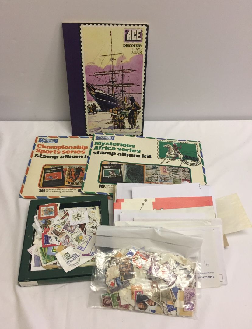 A box of loose British and foreign stamps together with 2 Hornby Stamp Album kits and an Ace