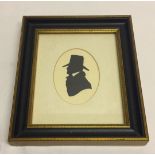 A framed & glazed silhouette of a gentleman. Framed size approx 16 x 19cm.