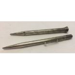 2 silver propelling pencils.