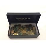 A small box containing world coins.