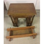 A light oak nest of 3 tables together with a small wooden shelf.