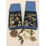 2 boxes of costume jewellery brooches to include stone set examples.