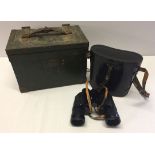 A cased set of Universe binoculars together with a small metal banded wooden box.