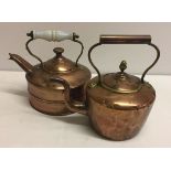 2 copper kettles, one with ceramic handle.