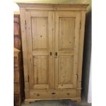 2 door vintage pine wardrobe single drawer in the base. 197cm tall x 128cm wide x 57cm deep.