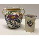 A Poole Pottery 2 handled vase 13cm tall together with a Poole beaker 9cm tall (firing fault to