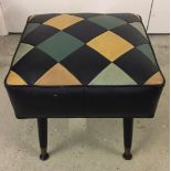 A retro design leatherette footstool with screw in legs.