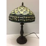 A Tiffany style lamp with leaded glass lampshade.