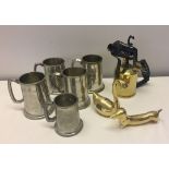 A box of mixed metalware to include pewter mugs and brass blow lamp.