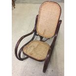 A small cane seated Bentwood childs rocking chair.