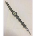 A ladies Sekonda watch with marcasite set strap.