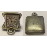 A small silver cased travelling watch/clock, Birmingham 1935. Not working.