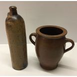 A 19th century German stoneware bottle together with a pottery 2 handled pot. Bottle 30cm tall,