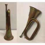 A vintage Arqyll & Sutherland Highlanders military bugle with Regimental badge to horn.