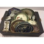 A box of mixed items to include glassware, Wedgwood plates and silver plated boxed baby's rattle.