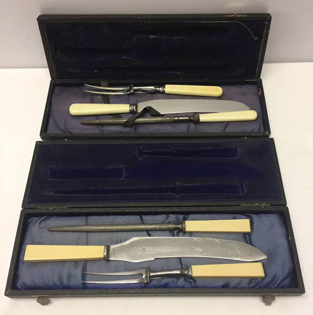 2 boxed Sheffield stainless steel carving sets.