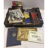 A box of auction catalogues and books to include Sotheby's and Bonhams.
