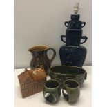 A small collection of Holkham Pottery to include lamp base (small chip to base), money box & jug.