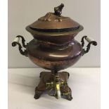 A copper Samovar made by William S. Burton, Oxford St.