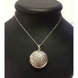 A 925 silver locket and chain with a celtic design to the front.