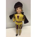 A vintage German Heubach Koppelsdorf doll 10 inches tall in Swiss Guard uniform. Head #40775/0.