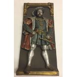 A modern wall hanging plaque depicting Henry VIII.