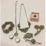 A collection of silver and white metal jewellery to include a silver St. Christopher and marcasite