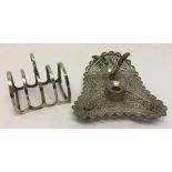 A silver toast rack hallmarked Birmingham 1931 together with a white metal Indian filligree